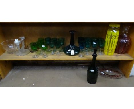 A shelf of Bristol Green glasses, decanters, and vases 