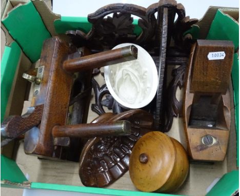 An Antique carpenter's plane, jelly moulds, a wall bracket etc