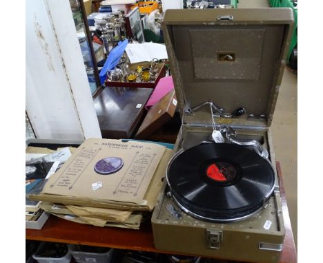 A HMV portable wind-up record player with a quantity of 78RPM records