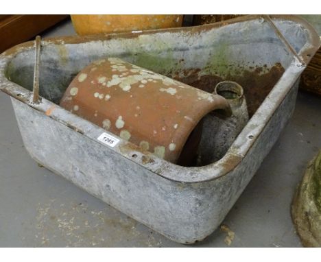 A cast-iron rain hopper, a galvanized terracotta cowling, and a galvanized metal planter (4)