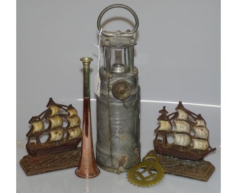 A Vintage Admiralty Oldham lantern automatic type, and a pair of Vintage cast-iron ship design doorstops