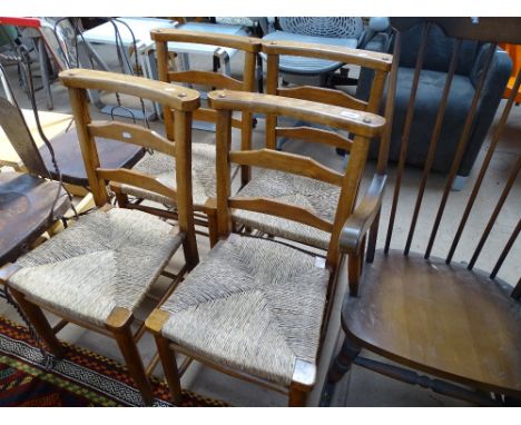 A set of 4 rush-seated ladder-back chapel chairs.