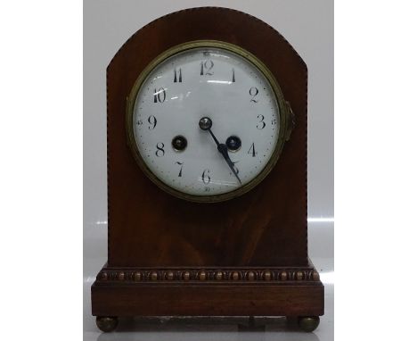 An Edwardian mahogany and banded dome top mantel clock with enamel dial and 8-day striking movement, height  9.5"