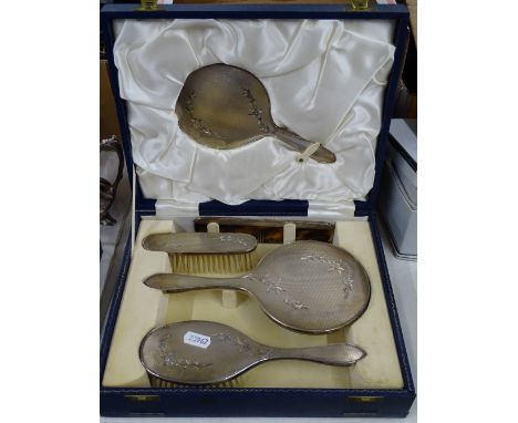 A 5-piece engraved and engine turned silver-backed dressing table brush and mirror set, cased