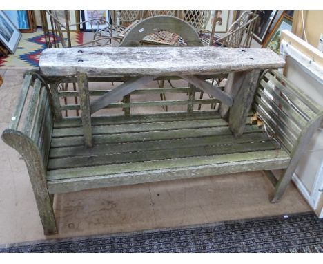 A hardwood slatted weathered garden bench and stool