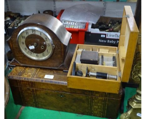 A Victorian walnut writing slope, a microscope, and mantel clock