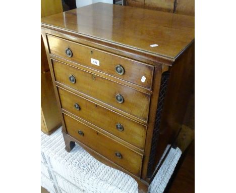 An Edwardian narrow 4-drawer chest on bracket feet, W 60cm