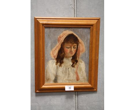 A FRAMED OIL ON BOARD PORTRAIT STUDY OF A GIRL IN A BONNET INITIALLED E. W. 