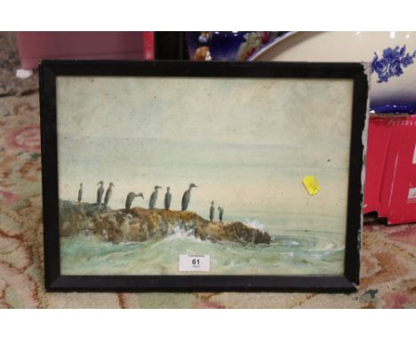 A FRAMED AND GLAZED WATERCOLOUR SEASCAPE WITH BIRDS ON A ROCKY OUTCROP 