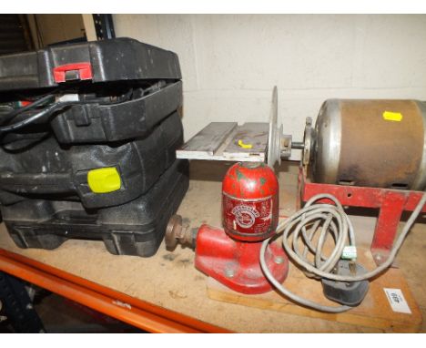 A BENCH GRINDER TOGETHER WITH CASED POWER TOOLS