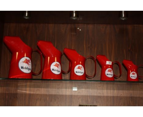 A SET OF FIVE GRADUATING REPRODUCTION MOBIL GAS OIL CANS
