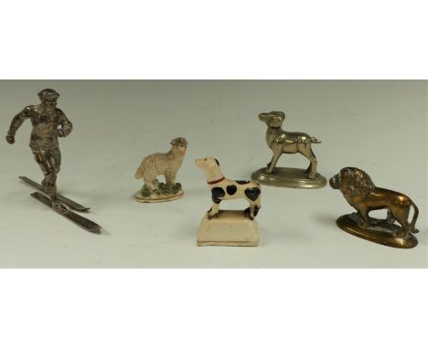 A selection of figures including a skier (trophy?), 2 ceramic sheep, one with red anchor mark etc