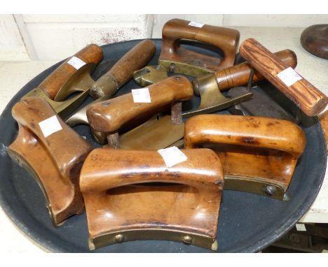 A collection of mainly brass mounted treen hatters tools to include brim curlers 