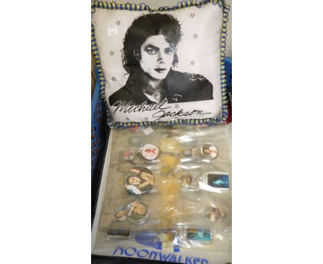 A collection of Michael Jackson key fobs and other collectables