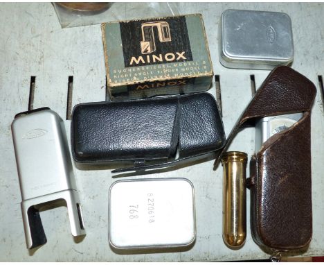 A MINOX miniature camera including right angle view finder, instruction manual and accessories