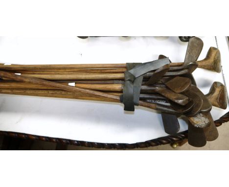 Twenty vintage golf clubs with hickory shafts
