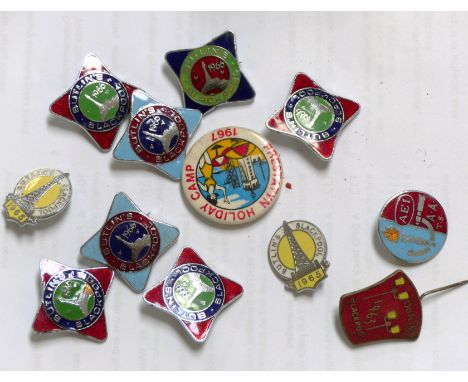 A collection of Butlins enamel badges etc