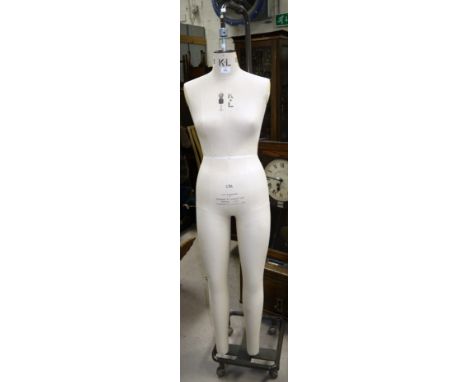 A vintage tailor's dummy (ladies size 12) by Kennett & Lindsell on tubular stand and castors