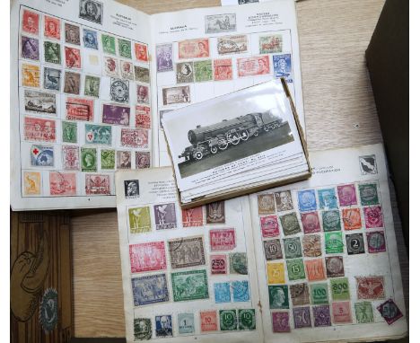 A Crusader stamp album and contents; a Super Jet similar; 30 1930's vintage postcards depicting steam locomotives and other r