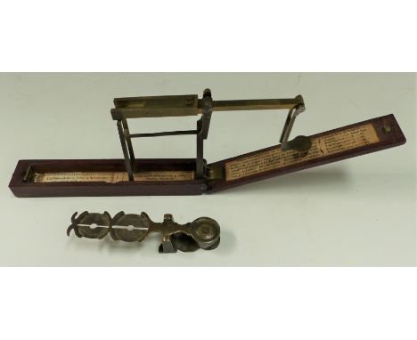 A mahogany folding guinea scale and a sovereign rocker scale
