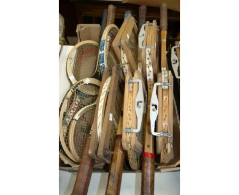 A selection of vintage tennis rackets with presses etc
