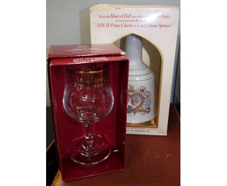 A Bells Scotch Whisky Decanter Charles & Diana Wedding Commemorative 75cl sealed, a commemorative Goblet for Wedding of Charl