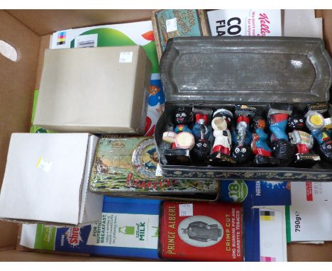 An 8 piece Robertson's Golly band; 3 vintage tins; 2 originally boxed miniature cuckoo clocks