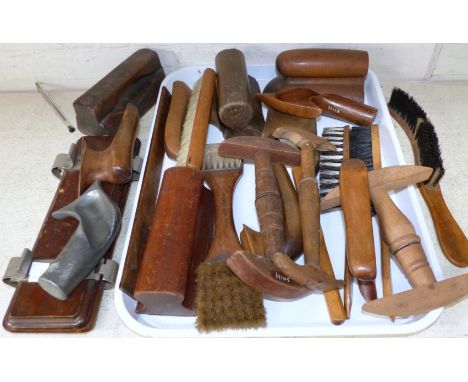 A collection of treen hatters tools including brushes and foot dummies