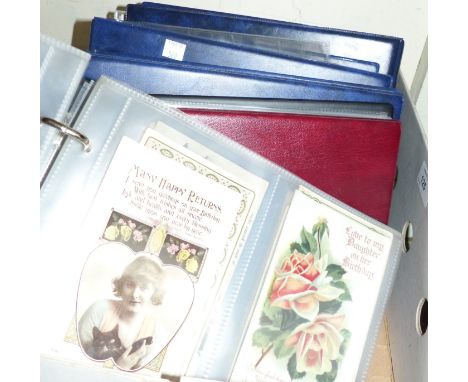 A collection of vintage postcards, 3 albums of cigarette cards