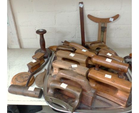 A 19th century brass hatters cross rule and a selection of hatters' treen tools including smoothing implements, foot and groo