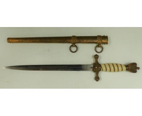 A WW11 naval dagger with eagle mount to finial, another to the hilt, blade stamped WKC overall length 15'' with gilt and bras