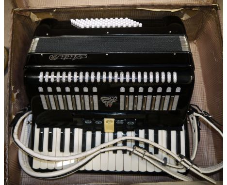 An Aide 72 base piano accordion in carrying case