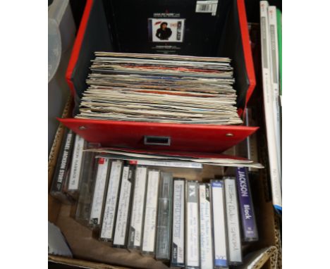 A collection of Michael Jackson 45rpm singles and cassettes