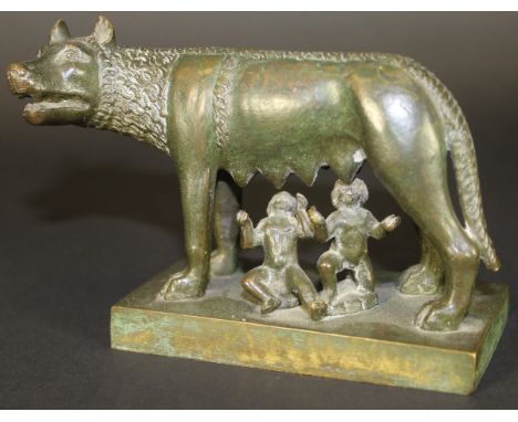 A bronze figure group of "Romulus and Remus" suckling from the she wolf, raised on a square plinth base with green verdigris 