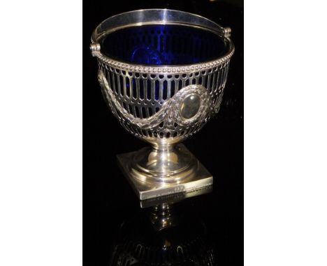 A Victorian silver pierced sugar basket with swing handle, raised on pedestal base to square foot, stamped "218 Hunt & Roskel