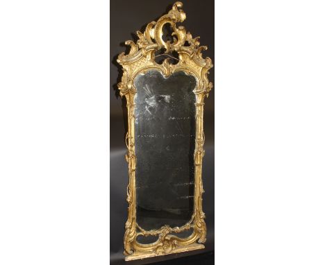 An 18th Century giltwood and gesso framed wall mirror in the Chinese Chippendale taste, the scroll work and acanthus carved c