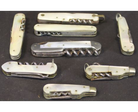 A collection of mother of pearl cased pocket knives, each with multi-tools and corkscrews (8)