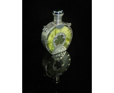 A Victorian green hardstone scent bottle with white metal mounts depicting various Irish symbols to include clover, harp, hor