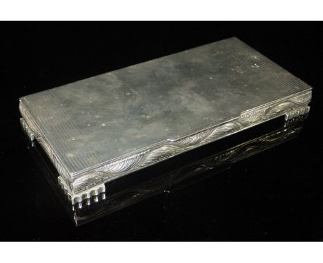 An early 20th Century Indian white metal cigarette box in the Art Deco manner, the top with engine turned decoration, the sid