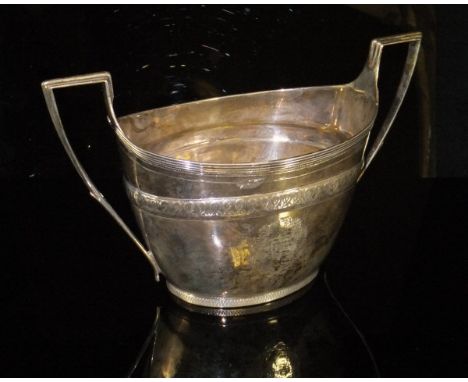 A George III silver twin-handled sugar basin of boat form with engraved knot decorated band above two floral wreaths, one bea