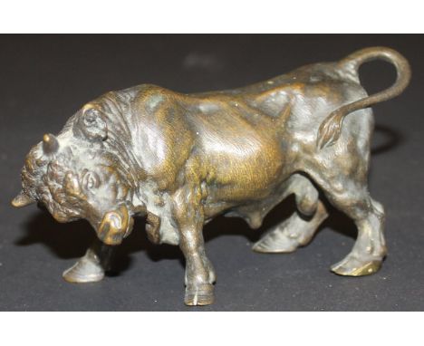 A 19th Century Continental bronze figure of a bull charging, approx 13.5 cm long(Provenance: the property of the Raymond Bark