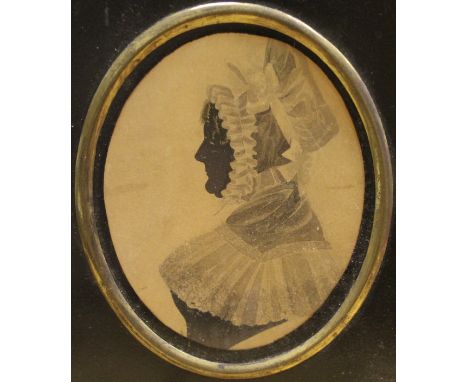 19TH CENTURY ENGLISH SCHOOL "Mary Lavery" a miniature silhouette portrait, bust , oval inscribed with family information vers