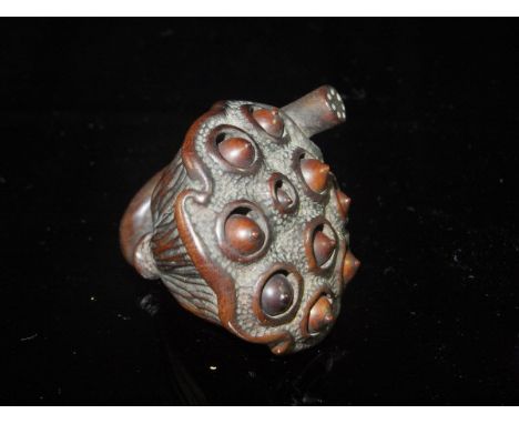 A Japanese Meiji Period carved boxwood netsuke as a lotus flower seed pod with moving seeds, approx 4.1 cm long CONDITION REP