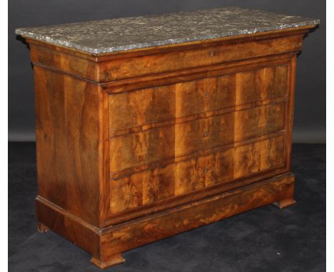 A Louis Phillipe mahogany commode, the grey veined marble top above a cushion drawer and three further drawers with a moulded