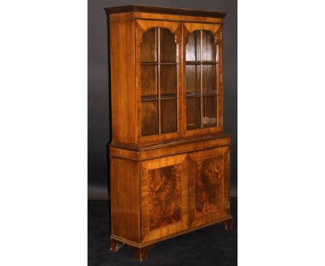 DAVID BERESFORD (AKA BERESOFSKY) An early 20th Century walnut and cross banded display cabinet with Cavetto moulded pediment 
