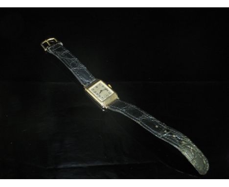 A Rotary 9 carat gold cased gentleman's wristwatch, the rectangular silvered dial with Arabic numerals and subsidiary seconds