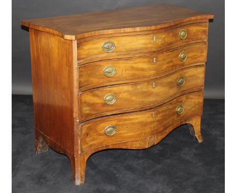 A George III serpentine fronted mahogany chest of four graduated drawers, the shaped top above four graduated drawers with br