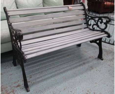 GARDEN BENCH, Victorian style, curved, slatted seat with scrolling black painted metal-work ends, 130cm L. 