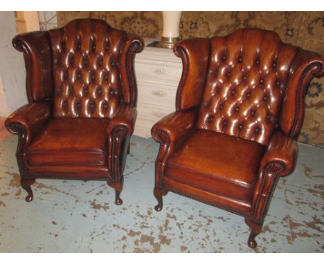 WING ARMCHAIRS, a pair, Queen Anne design vintage tan brown leather with deep button upholstered back and cabriole front supp
