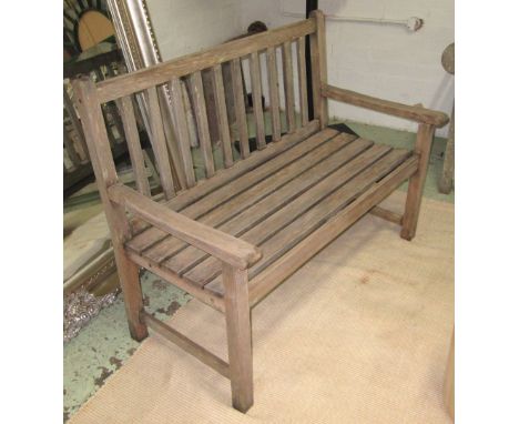 GARDEN BENCH, weathered teak of slatted construction, 116 cm W.